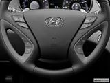  Steering wheel controls close-up. Leveled and from the left photo
