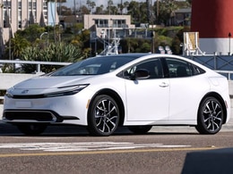 2026 Toyota Prius Plug-in Hybrid front-facing, side angle cropped car colored image